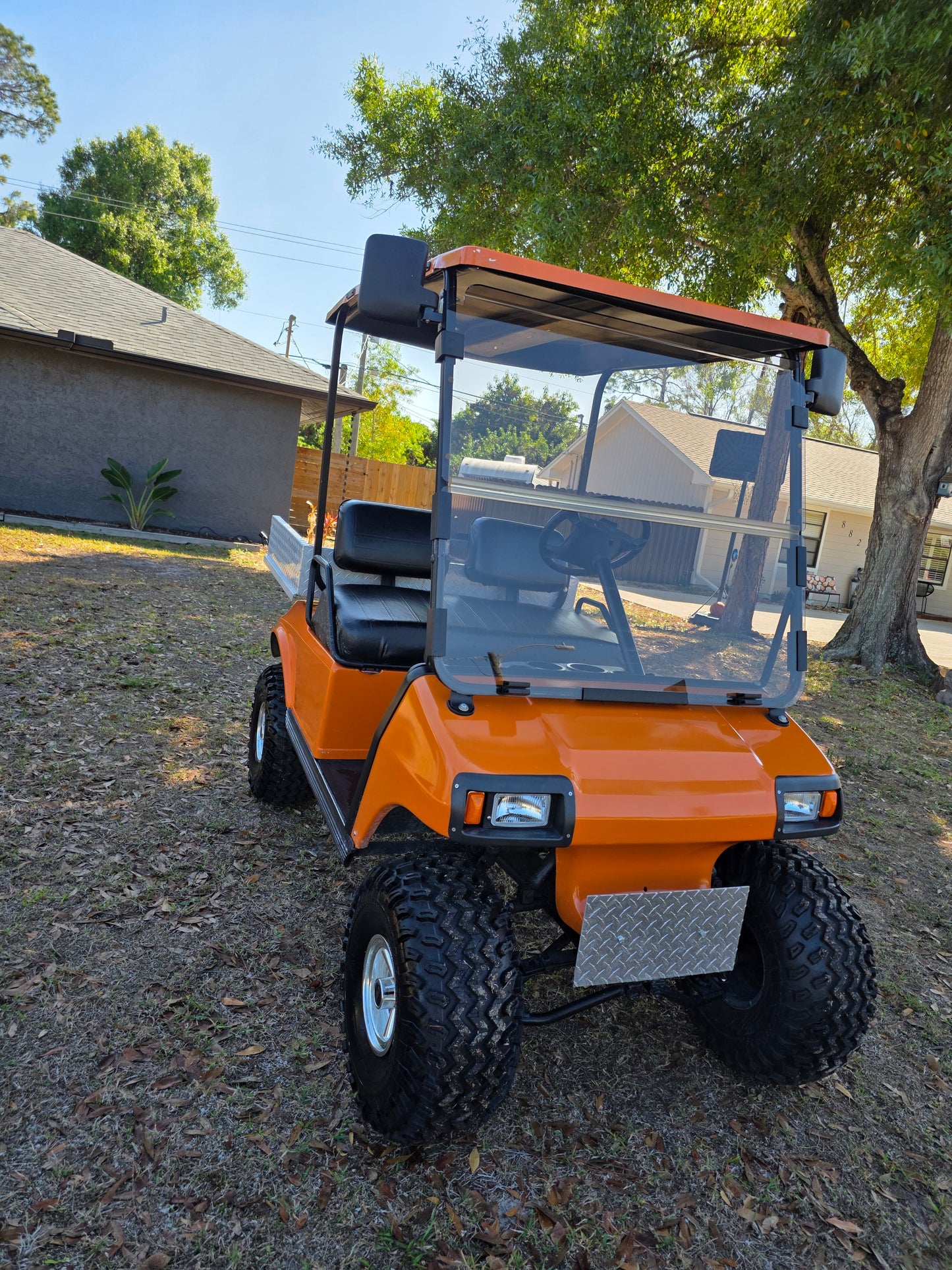 1995 Club Car DS Lifted – 36V | Orange | 23” All-Terrain Tires